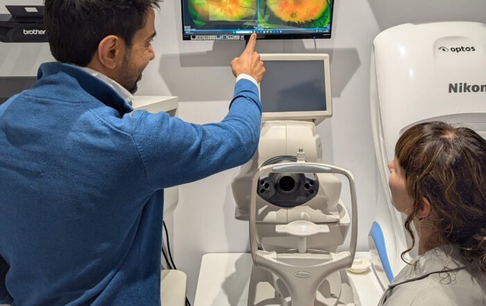 Paras Kothari reviewing an Optomap scan with a patient at The Eye Centre in South London
